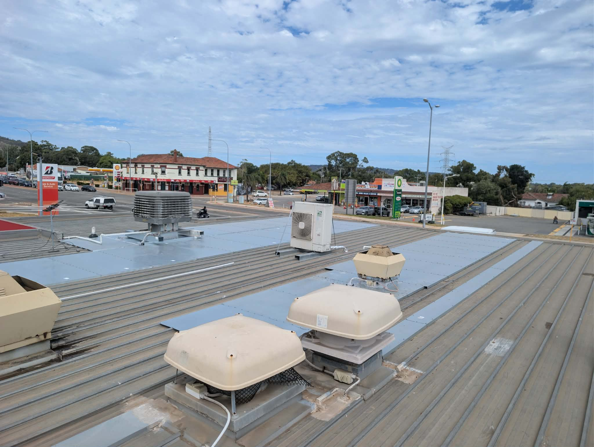 Roof maintenance at Ampol service station, Midvale